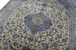 Backside of handmade 2000s Kashan rug showing knot structure and weave density