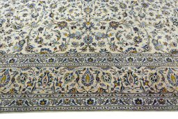 Corner detail of 2000s Kashan rug showing border pattern and Wool pile