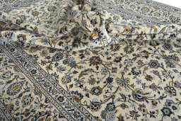 Surface texture of 2000s Kashan rug with natural Wool and intricate pattern