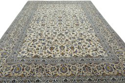 Surface texture of 2000s Kashan rug with natural Wool and intricate pattern