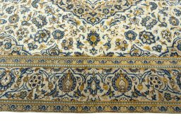 Corner detail of 2000s Kashan rug showing border pattern and Wool pile