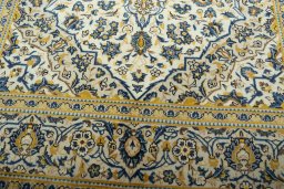 Close-up detail of 2000s Kashan rug from Iran / Persia showing Wool weave