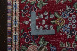 Backside of handmade New Kashan rug showing knot structure and weave density