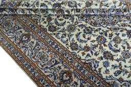 Close-up detail of 2000s Kashan rug from Iran / Persia showing Wool weave