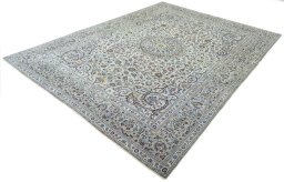 Corner detail of 2000s Kashan rug showing border pattern and Cork pile