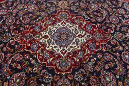 Central medallion detail of 2000s Kashan rug from Iran / Persia