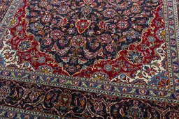 Close-up detail of 2000s Kashan rug from Iran / Persia showing Wool weave