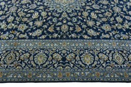 Corner detail of 2000s Kashan rug showing border pattern and Wool pile