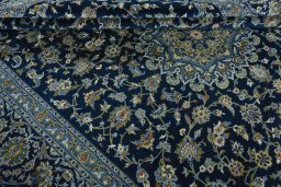 Close-up detail of 2000s Kashan rug from Iran / Persia showing Wool weave