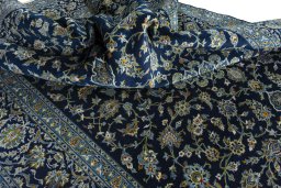 Surface texture of 2000s Kashan rug with natural Wool and intricate pattern