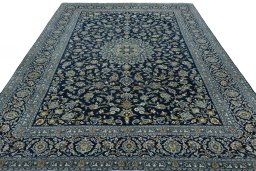 Surface texture of 2000s Kashan rug with natural Wool and intricate pattern