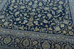 Close-up detail of 2000s Kashan rug from Iran / Persia showing Wool weave