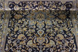 Close-up detail of 1970s Kashan rug from Iran / Persia showing Wool weave