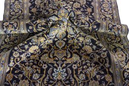 Surface texture of 1970s Kashan rug with natural Wool and intricate pattern