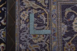 Backside of handmade 1970s Kashan rug showing knot structure and weave density