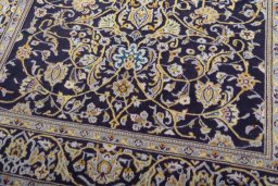 Close-up detail of 1970s Kashan rug from Iran / Persia showing Wool weave