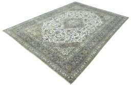 Corner detail of 2000s Kashan rug showing border pattern and Wool pile