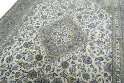 Backside of handmade 2000s Kashan rug showing knot structure and weave density