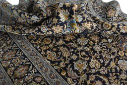 Surface texture of 2000s Kashan rug with natural Wool and intricate pattern