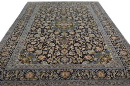Surface texture of 2000s Kashan rug with natural Wool and intricate pattern