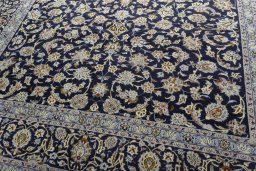 Close-up detail of 2000s Kashan rug from Iran / Persia showing Wool weave