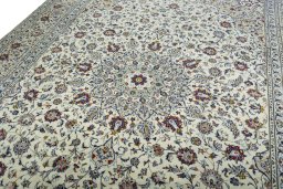 Backside of handmade 2000s Kashan rug showing knot structure and weave density
