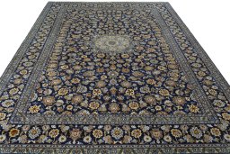 Surface texture of 2000s Kashan rug with natural Wool and intricate pattern