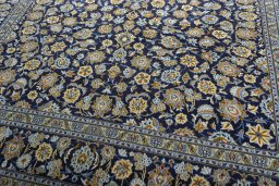 Close-up detail of 2000s Kashan rug from Iran / Persia showing Wool weave
