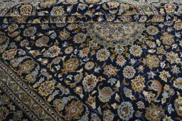 Close-up detail of 2000s Kashan rug from Iran / Persia showing Wool weave