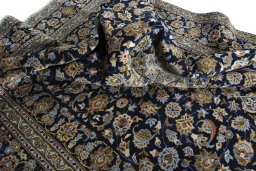 Surface texture of 2000s Kashan rug with natural Wool and intricate pattern