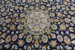 Central medallion detail of 2000s Kashan rug from Iran / Persia