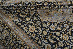 Close-up detail of 2000s Kashan rug from Iran / Persia showing Wool weave