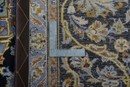 Close-up detail of 2000s Kashan rug from Iran / Persia showing Wool weave