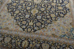Close-up detail of 2000s Kashan rug from Iran / Persia showing Wool weave