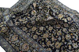 Surface texture of 2000s Kashan rug with natural Wool and intricate pattern