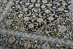 Close-up detail of 2000s Kashan rug from Iran / Persia showing Wool weave