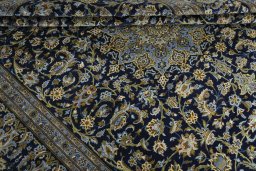 Close-up detail of 2000s Kashan rug from Iran / Persia showing Wool weave