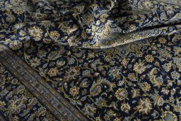 Surface texture of 2000s Kashan rug with natural Wool and intricate pattern