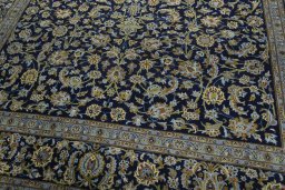 Close-up detail of 2000s Kashan rug from Iran / Persia showing Wool weave