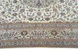 Corner detail of 2000s Kashan rug showing border pattern and Wool pile