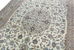 Backside of handmade 2000s Kashan rug showing knot structure and weave density