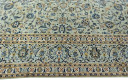 Corner detail of 1970s Kashan rug showing border pattern and Wool pile