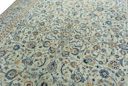 Backside of handmade 1970s Kashan rug showing knot structure and weave density