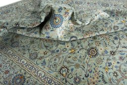 Surface texture of 2000s Kashan rug with natural Wool and intricate pattern