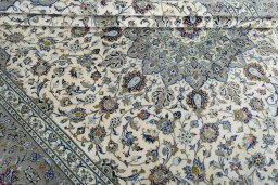 Close-up detail of 2000s Kashan rug from Iran / Persia showing Cork weave