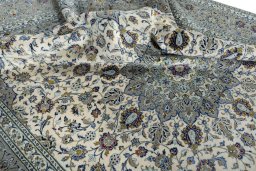 Surface texture of 2000s Kashan rug with natural Cork and intricate pattern