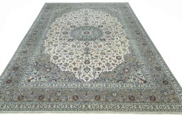 Surface texture of 2000s Kashan rug with natural Cork and intricate pattern