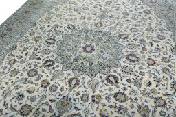 Backside of handmade 2000s Kashan rug showing knot structure and weave density