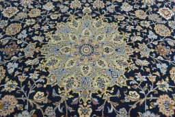 Central medallion detail of 2000s Kashan rug from Iran / Persia