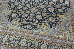 Close-up detail of 2000s Kashan rug from Iran / Persia showing Wool weave